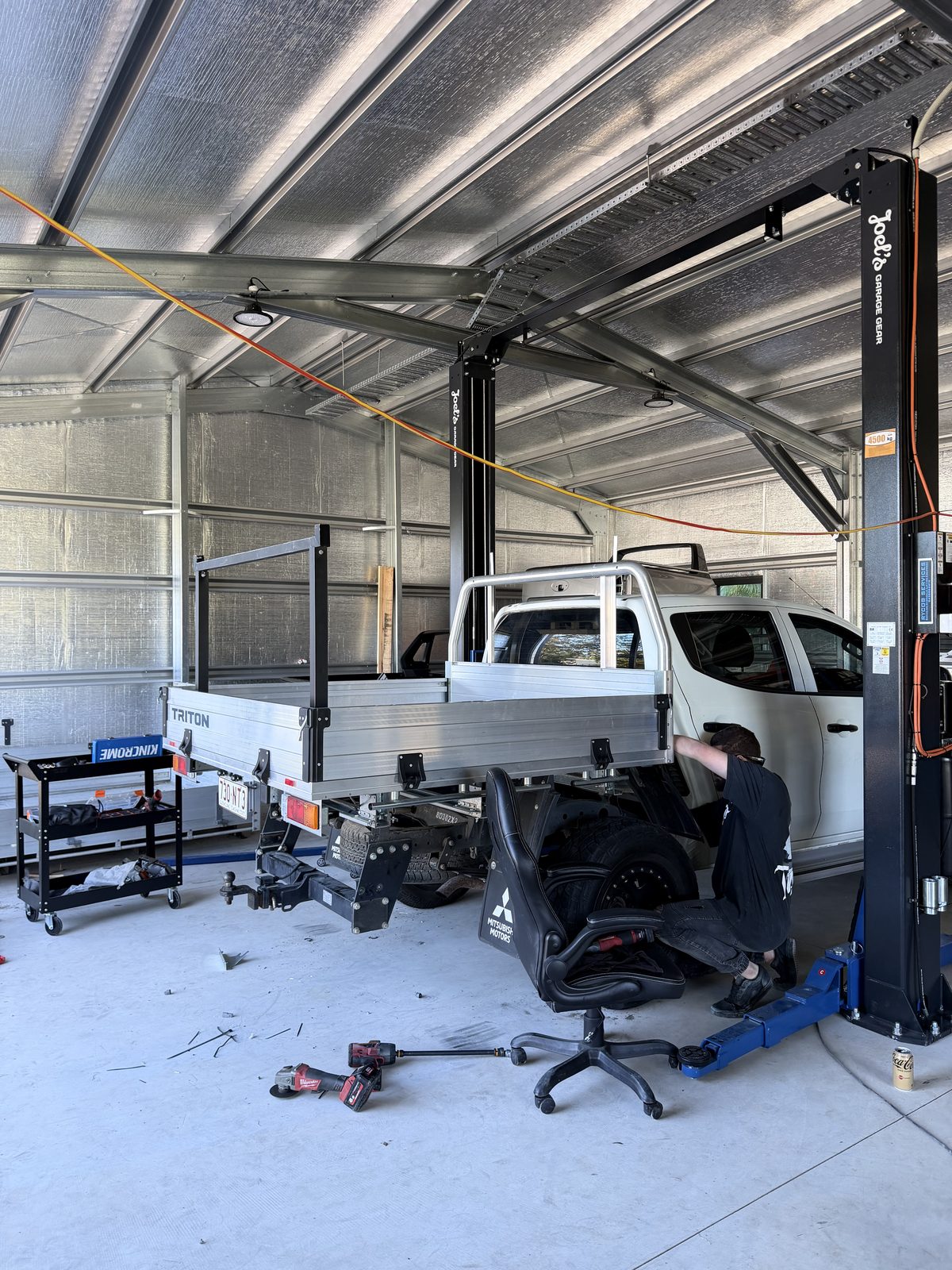 Ute on the hoist for tray installation at the JCC Trays workshop